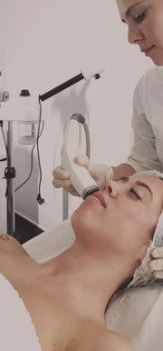 a woman getting a face massage